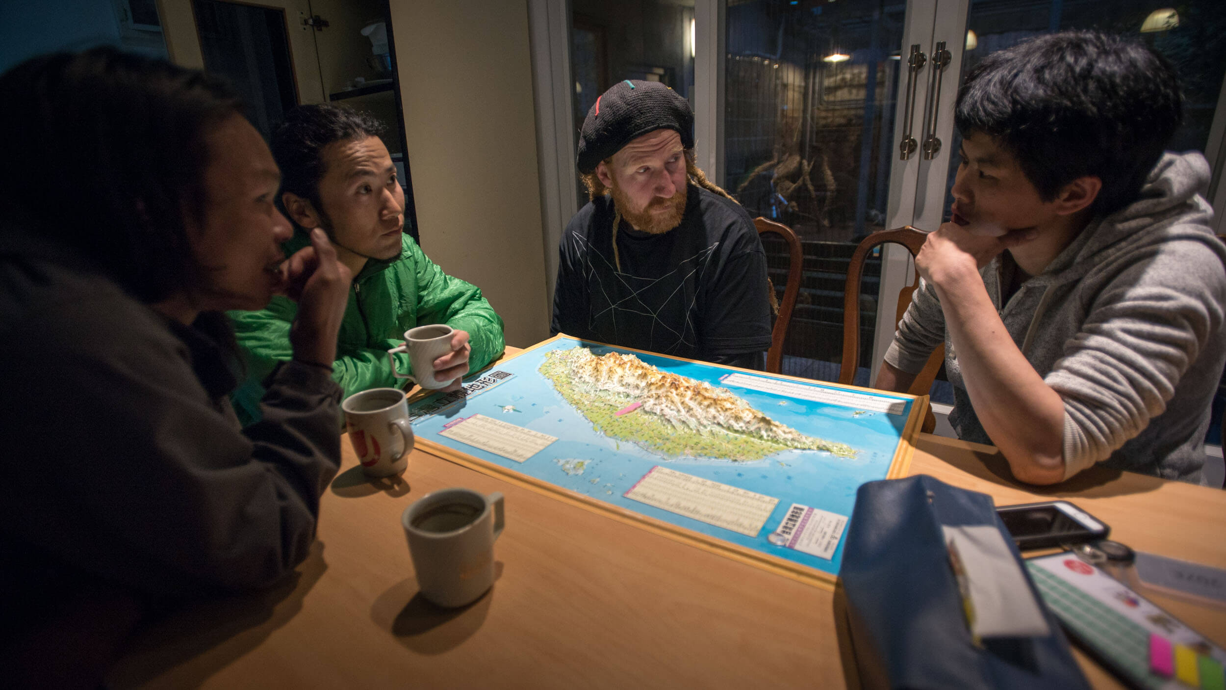 The team discusses the options for the expedition. From the left: Supii Liem, Akira Tanaka, Mike Harris and Jasmine Li