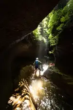 The wet season provides exciting water levels but some canyons might not be accessible; it also requires careful planning due to the daily tropical downpours which often result in flash floods. Here, Re:belay Editor Gus Schiavon during the first descent of Tukad Marah, Sekumpul.